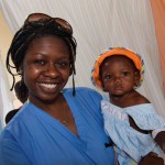 NOVA volunteer Fabiola Desmont with a child from Cavaillon